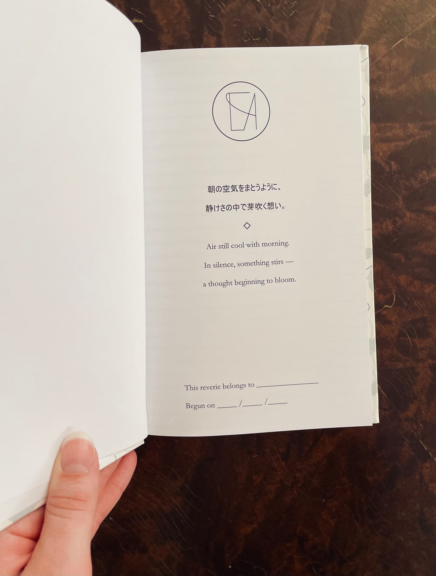 Open journal with poem on a wooden surface