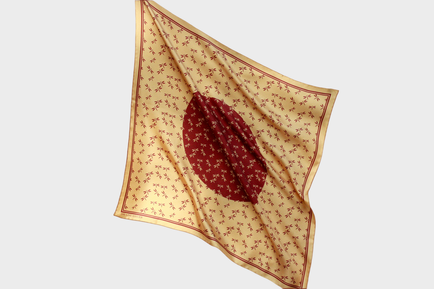 Golden 60cm silk scarf with a auburn dragonfly design on a beige background