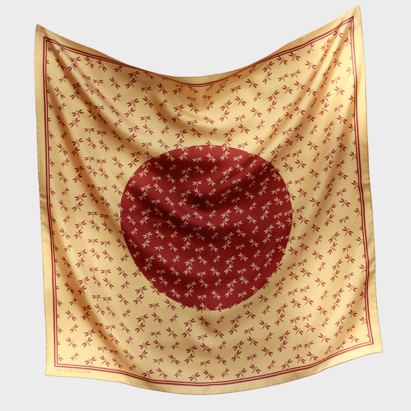 Golden silk 60cm scarf with an auburn circular pattern on a beige background