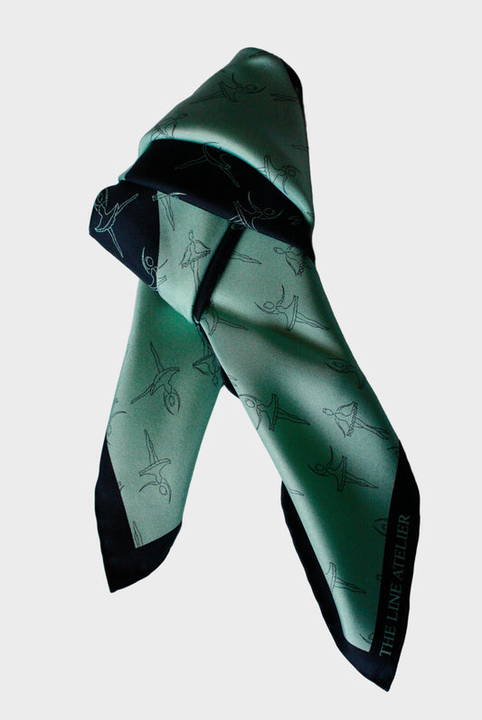 Green and black patterned silkscarf on a white background