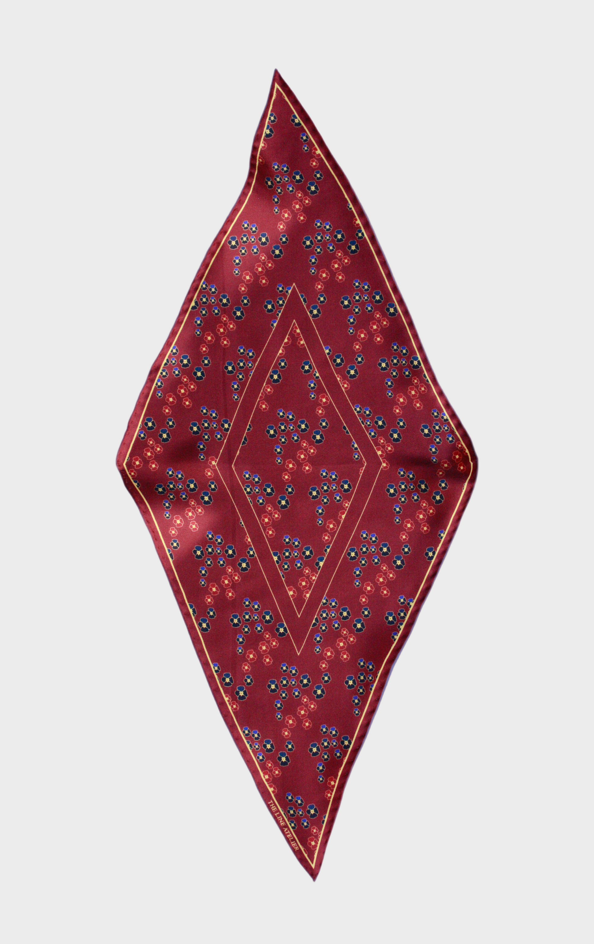 Hearts Ruby silk scarf by The Line Atelier, diamond size, with gem toned pansy flowers on a beige background