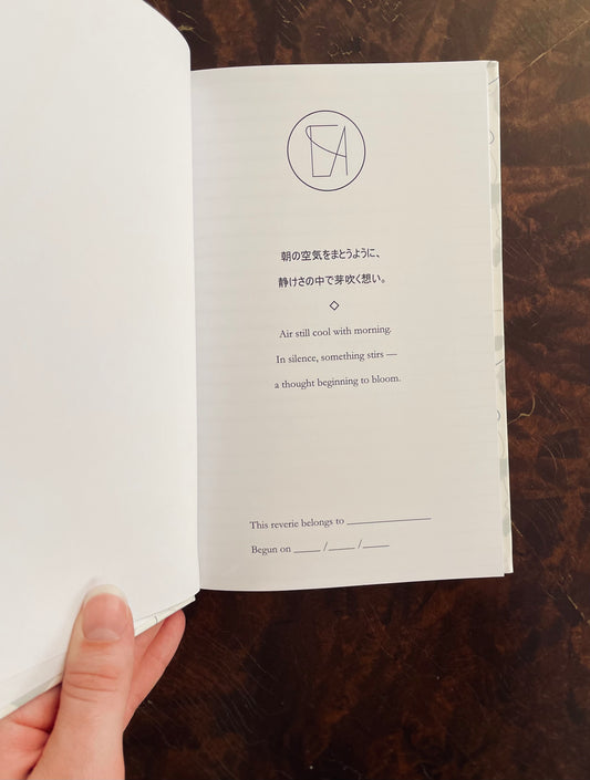 Open journal with poem on a wooden surface