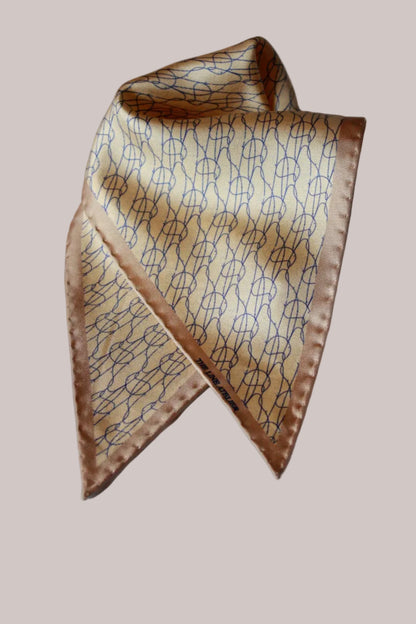 Rogue Of The Sands Diamond Sized Silk Scarf by The Line Atelier In Tan Silk With Abstract Blue Pattern And Hand Rolled Edges
