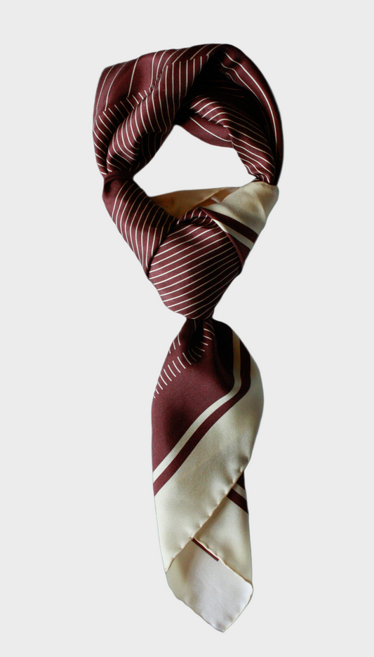 Striped scarf with brown and beige pattern on a solid background